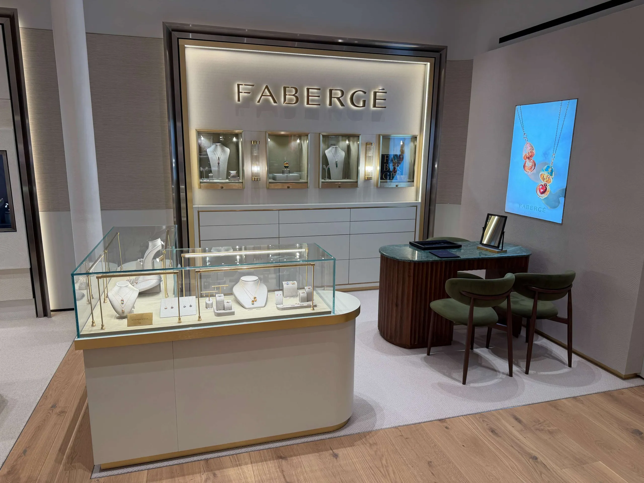 Fabergé concession with backlit jewellery display wall and glass counter