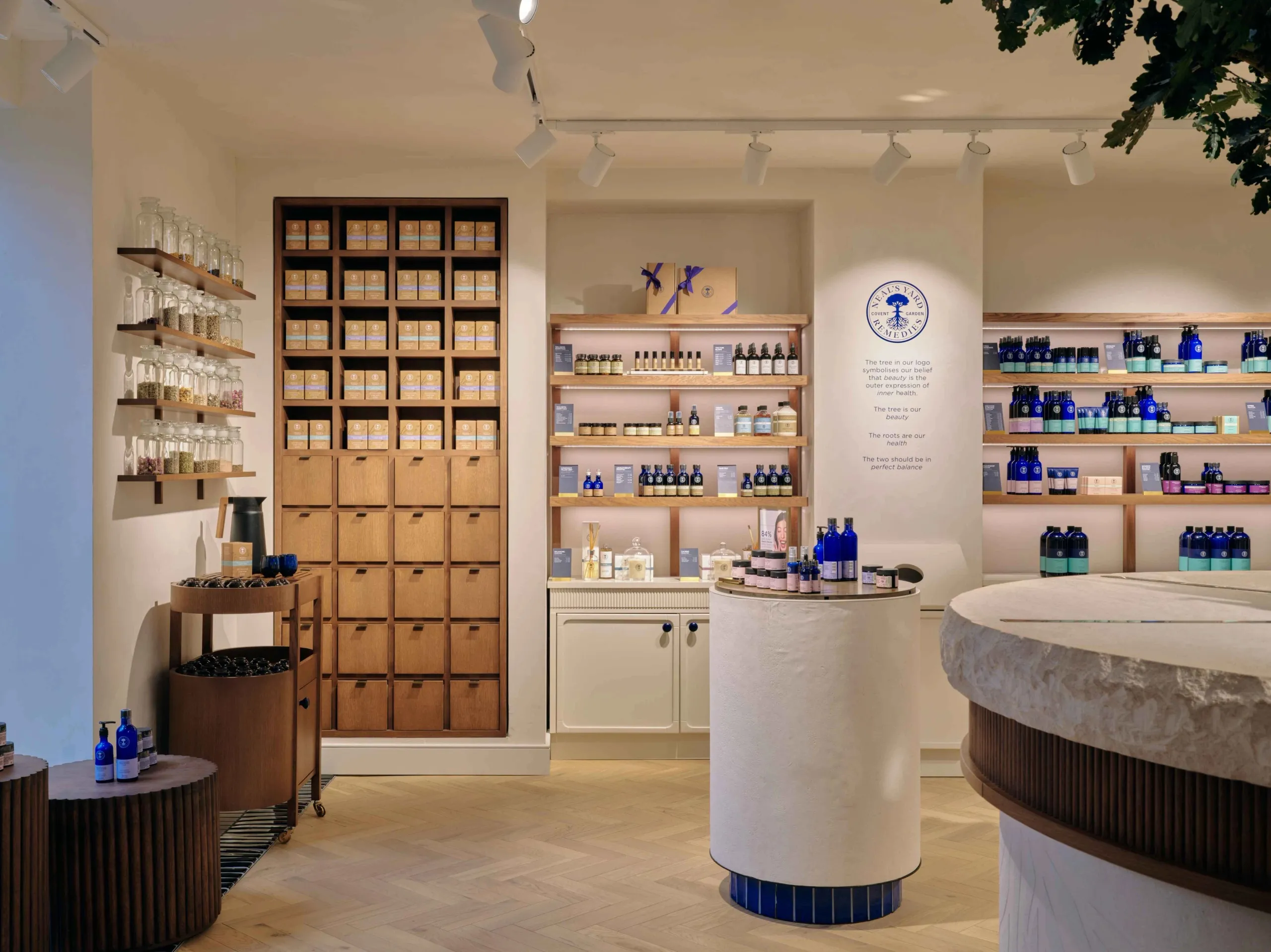 Neal's Yard Remedies refill station and timber cubby shelving